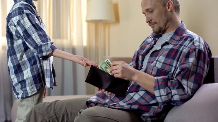 Son asking his father for money